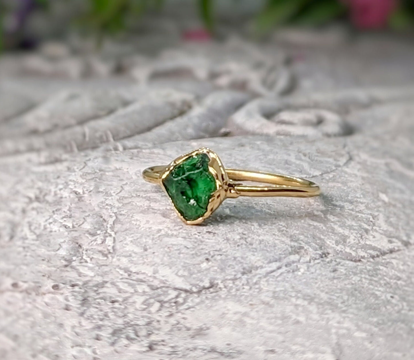 Handcrafted raw green Garnet ring with gold band, showcasing natural crystal beauty and uncut edges.