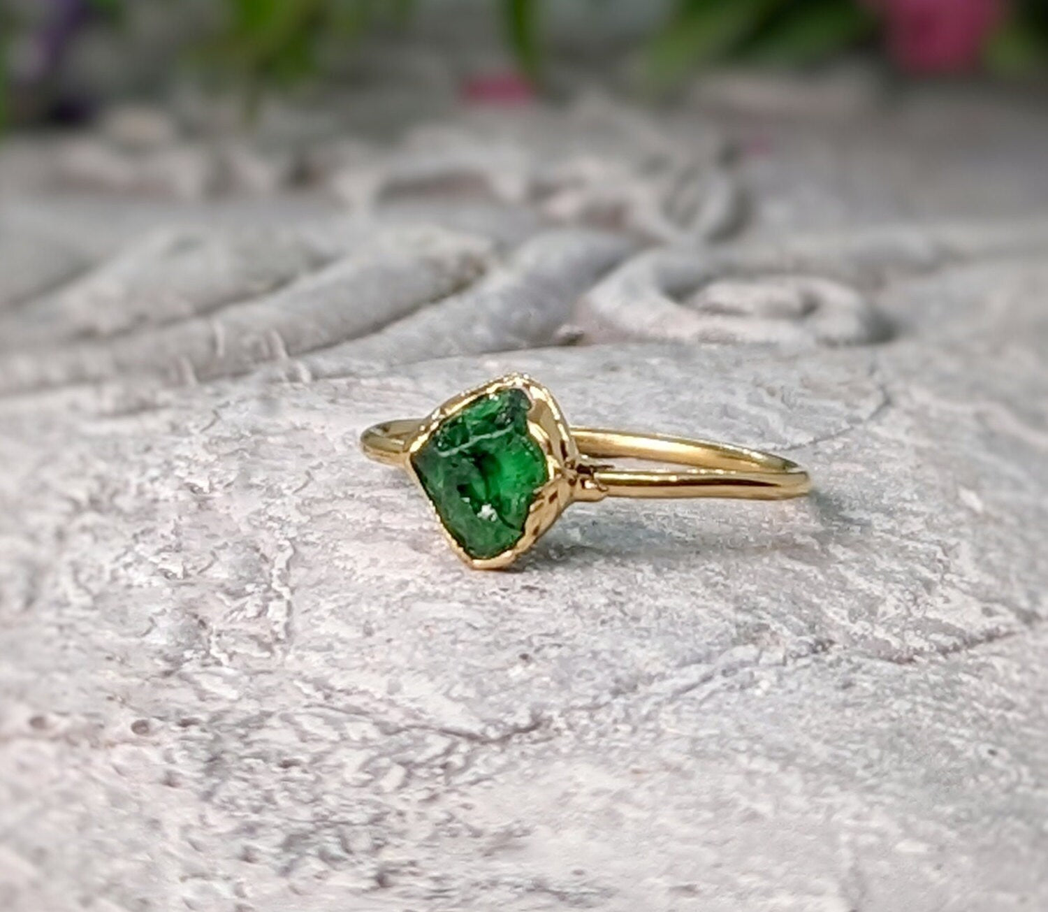 Handcrafted raw green Garnet ring with gold band, showcasing natural crystal beauty and uncut edges.