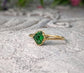 Handcrafted raw green Garnet ring with gold band, showcasing natural crystal beauty and uncut edges.