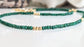 Emerald bead necklace featuring natural green beads with gold accents, symbolizing love and friendship.