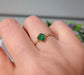 Handcrafted raw green Garnet ring on a hand, showcasing its earthy elegance and unique gemstone design.
