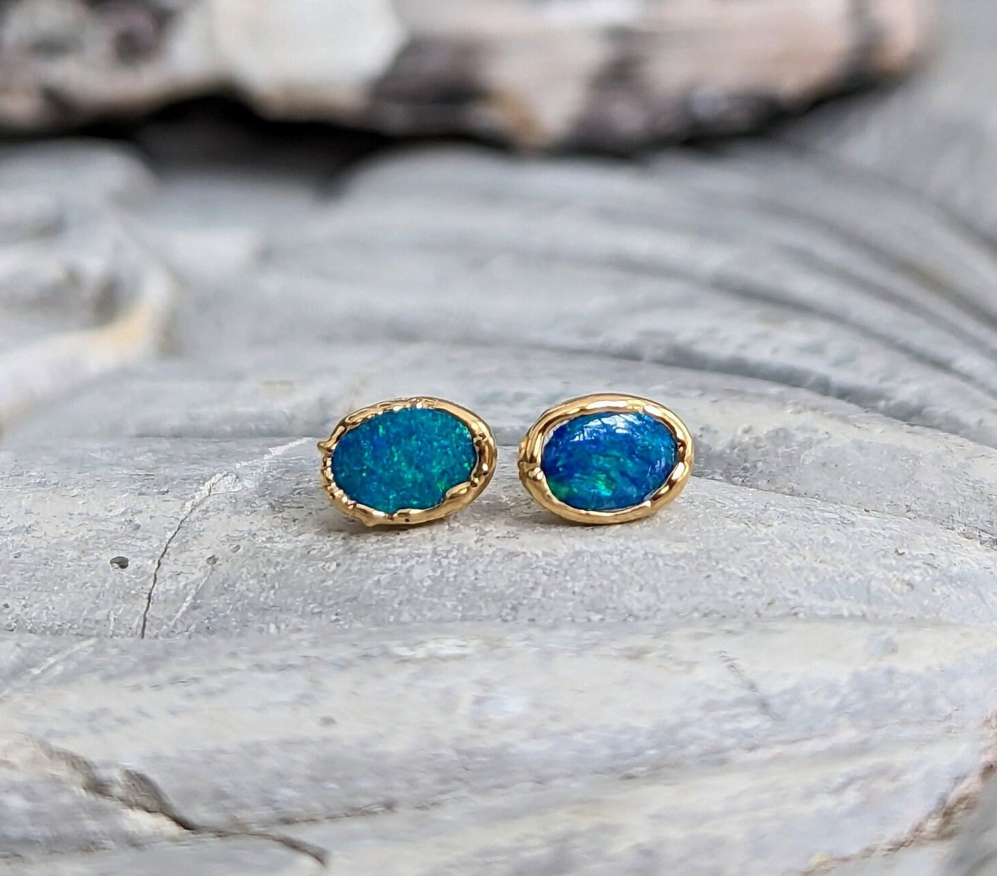 Blue Australian Opal stud earrings in 18k Gold, handcrafted elegance with vibrant blue hues.