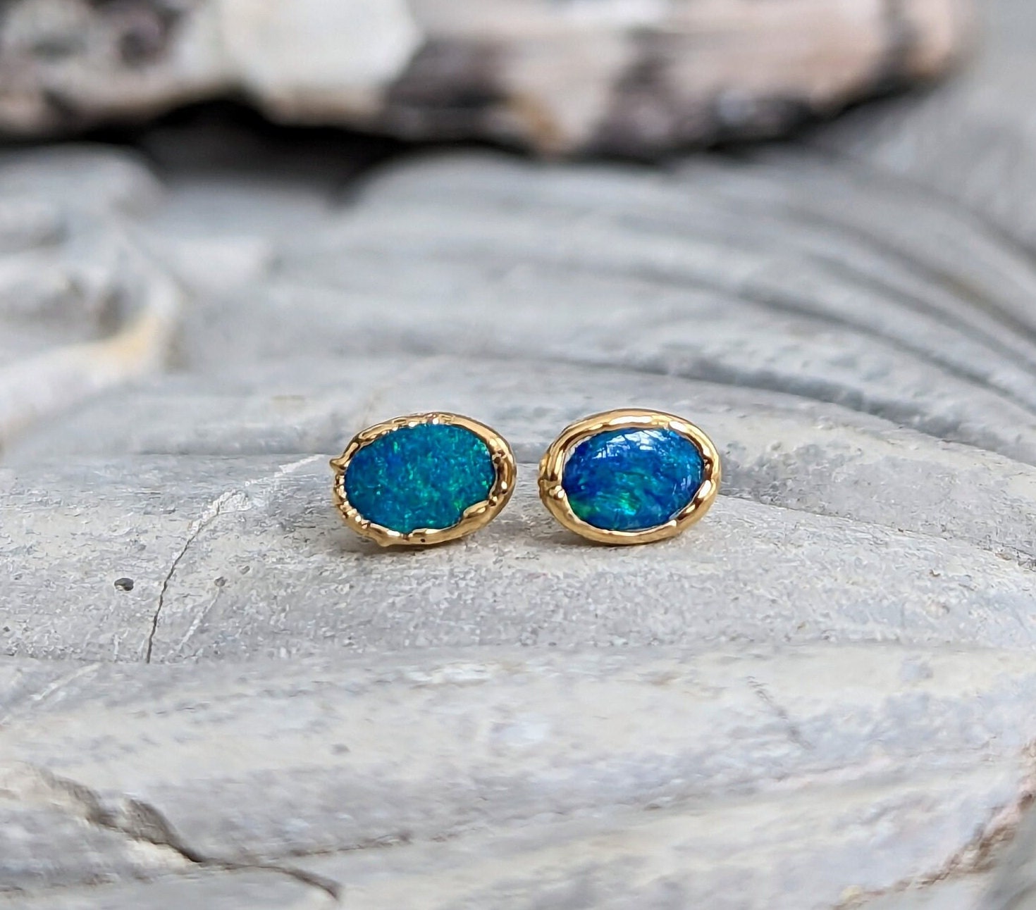 Blue Australian Opal stud earrings in 18k Gold, handcrafted elegance with vibrant blue hues.