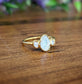 Raw rainbow Moonstone and Herkimer diamond engagement ring set in 14k gold with 18k gold plating.