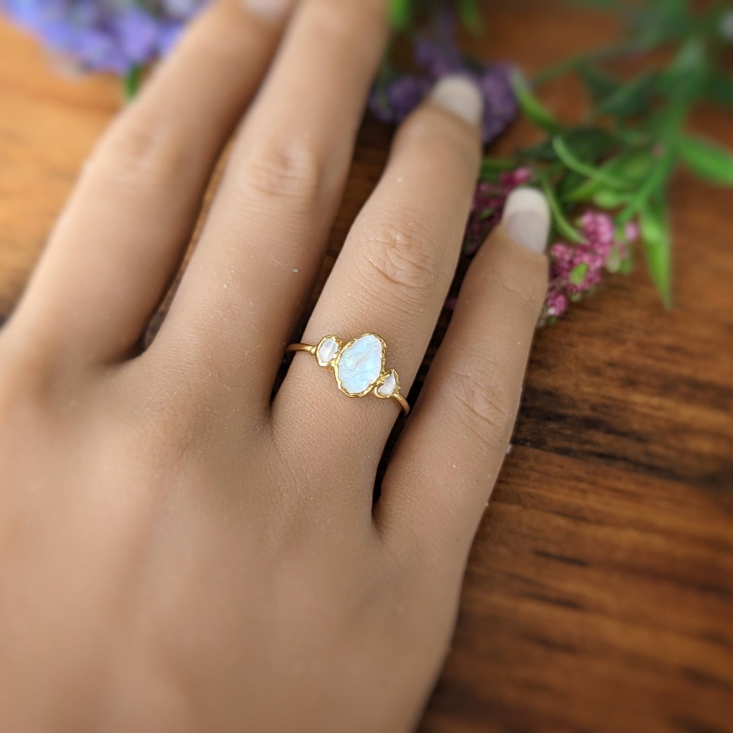 Raw rainbow Moonstone and Herkimer Diamond engagement ring on hand, set in 14k Gold filled band.