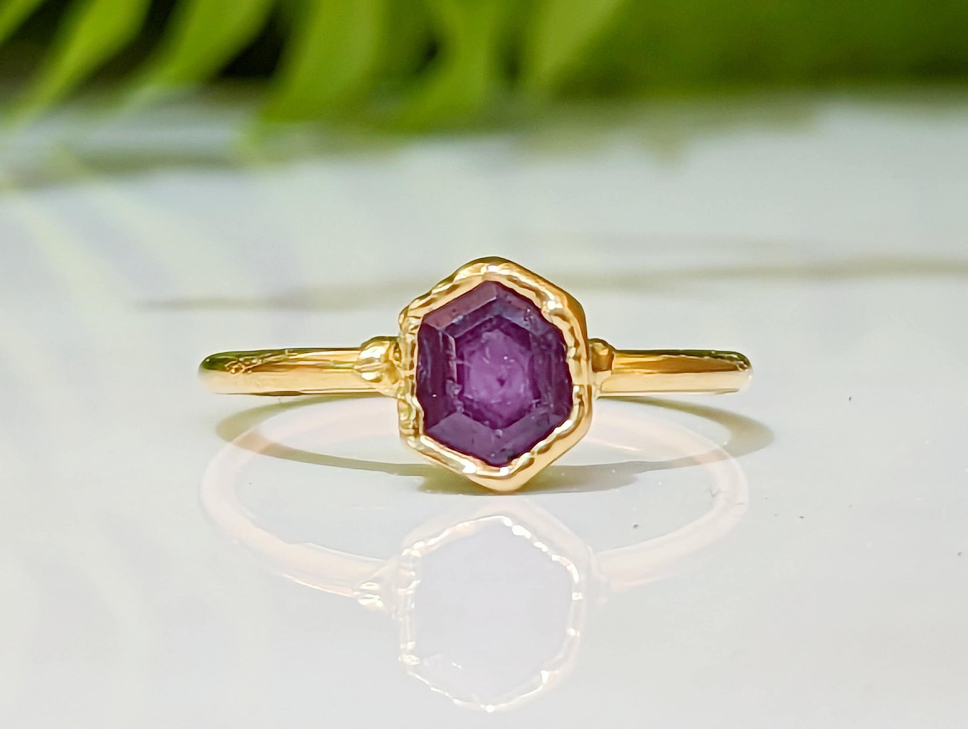 Natural pink sapphire ring in gold, handcrafted with a unique design, perfect for engagement or special gifts.
