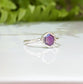 Pink Star Sapphire ring in handcrafted sterling silver, showcasing a unique natural design and vibrant colors.