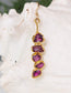 Elegant Rhodolite Garnet dangle earrings with raw raspberry pink gems and gold accents.