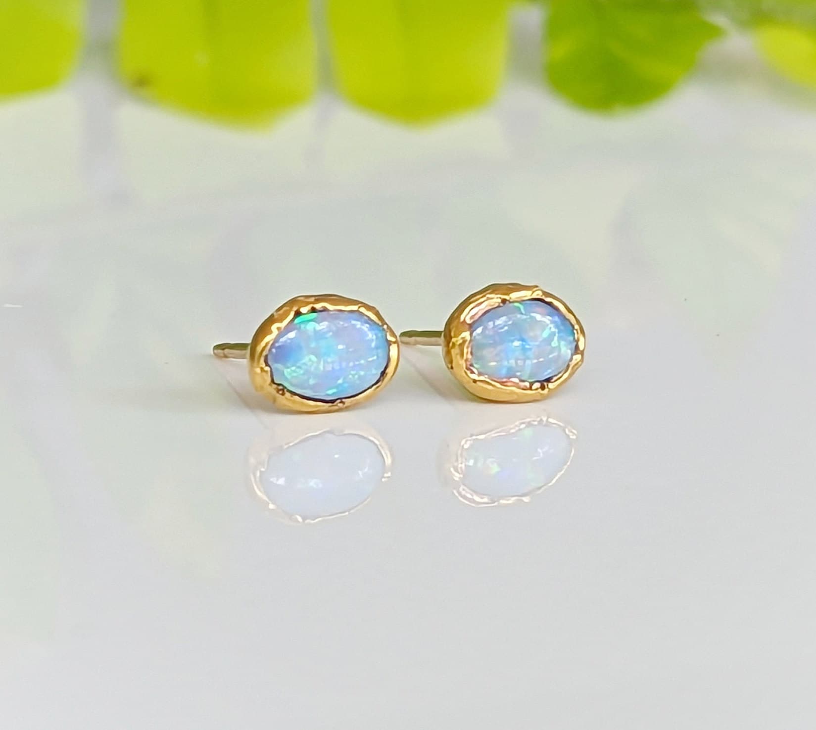 Light blue Australian Opal stud earrings on gold posts, elegant and perfect for gifts or bridal wear.