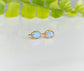 Light blue Australian Opal stud earrings on 14k gold filled posts, reflecting elegance and sophistication.