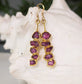 Stunning Rhodolite Garnet dangle earrings with raw raspberry pink stones, perfect for bridal or special occasions.