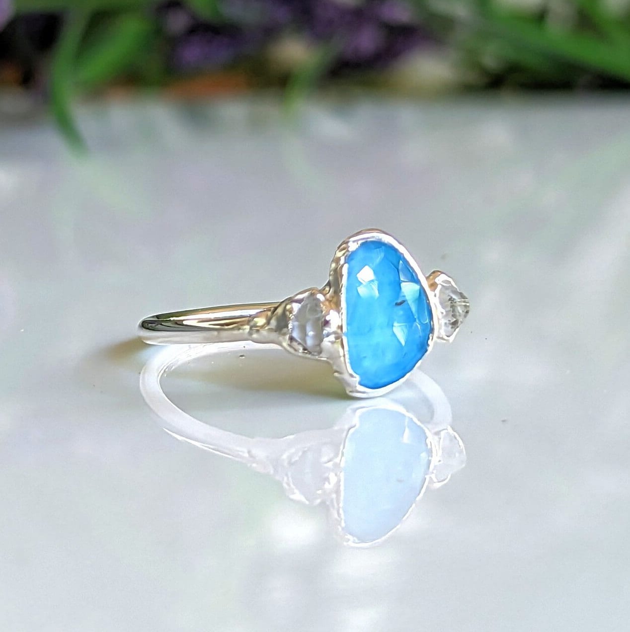 Sterling silver engagement ring featuring a rose cut Blue Topaz and Herkimer diamonds, perfect for unique gifts.