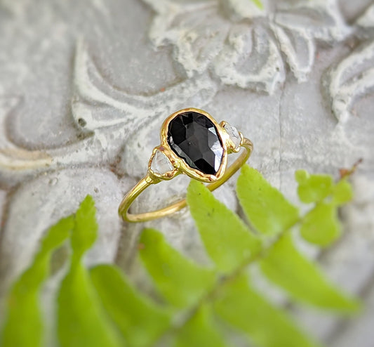 Black Spinel and Herkimer diamond engagement ring in 18k gold, showcasing unique handcrafted design and elegance.