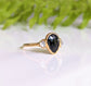 Black Spinel engagement ring with Herkimer diamonds in 18k gold, showcasing unique dark elegance and handcrafted design.