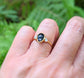 Black Spinel and Herkimer diamond engagement ring on hand, set in solid 18k gold, showcasing unique craftsmanship.