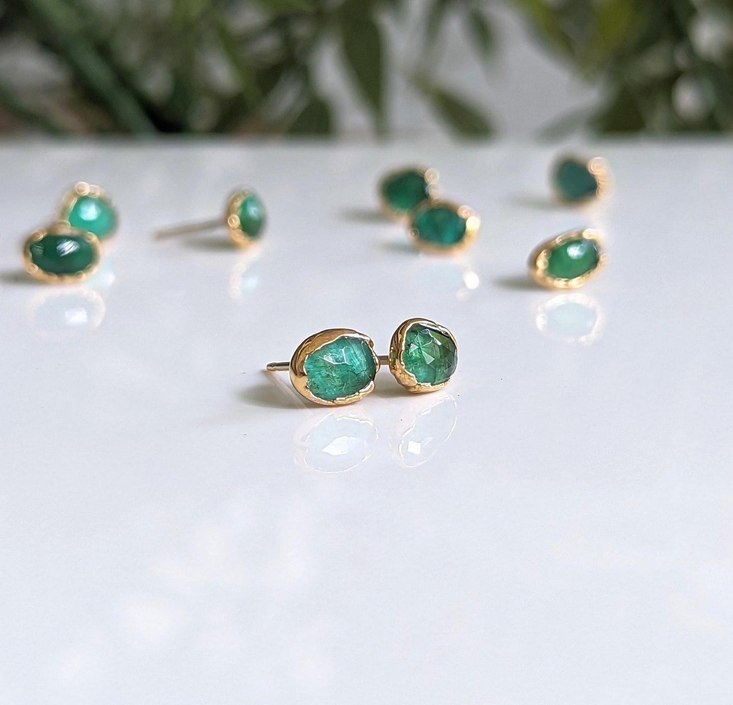 Natural Emerald stud earrings in 18k Gold setting, showcasing elegance and sophistication, perfect for gifts and bridal wear.