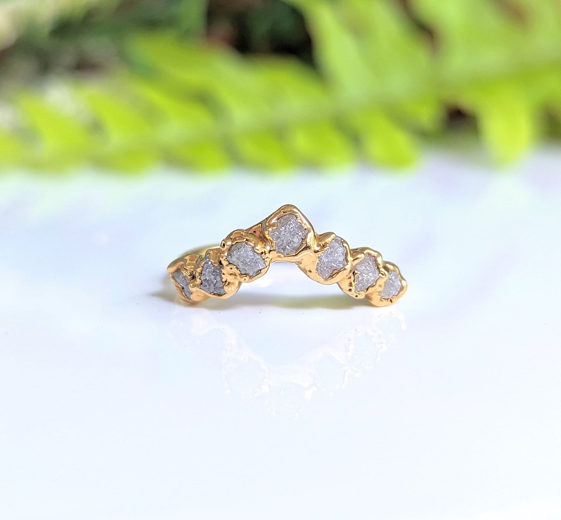 Raw diamond wedding ring set in solid 18k gold, featuring five unique raw diamonds for a stunning bridal look.