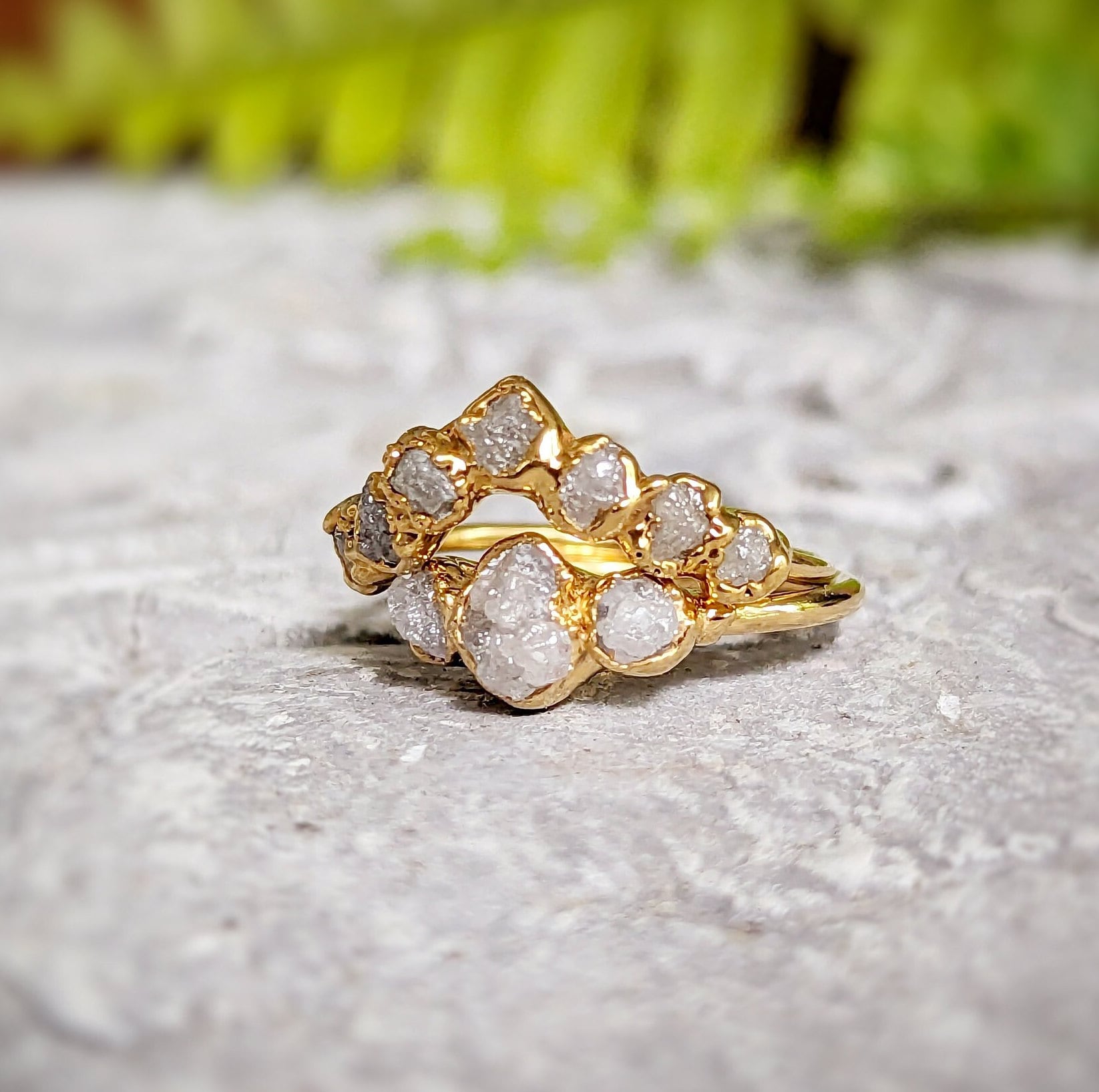 Raw diamond wedding ring set in solid 18k gold, featuring unique raw diamonds in a stunning design.