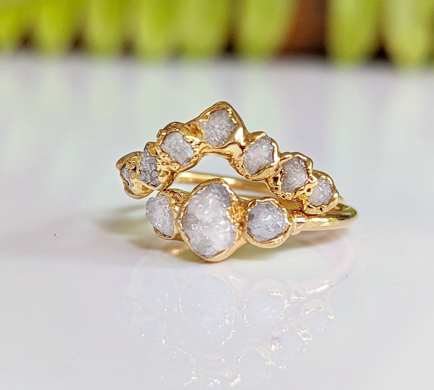 Raw diamond wedding ring set in solid 18k gold with unique organic design and sparkling raw diamonds.