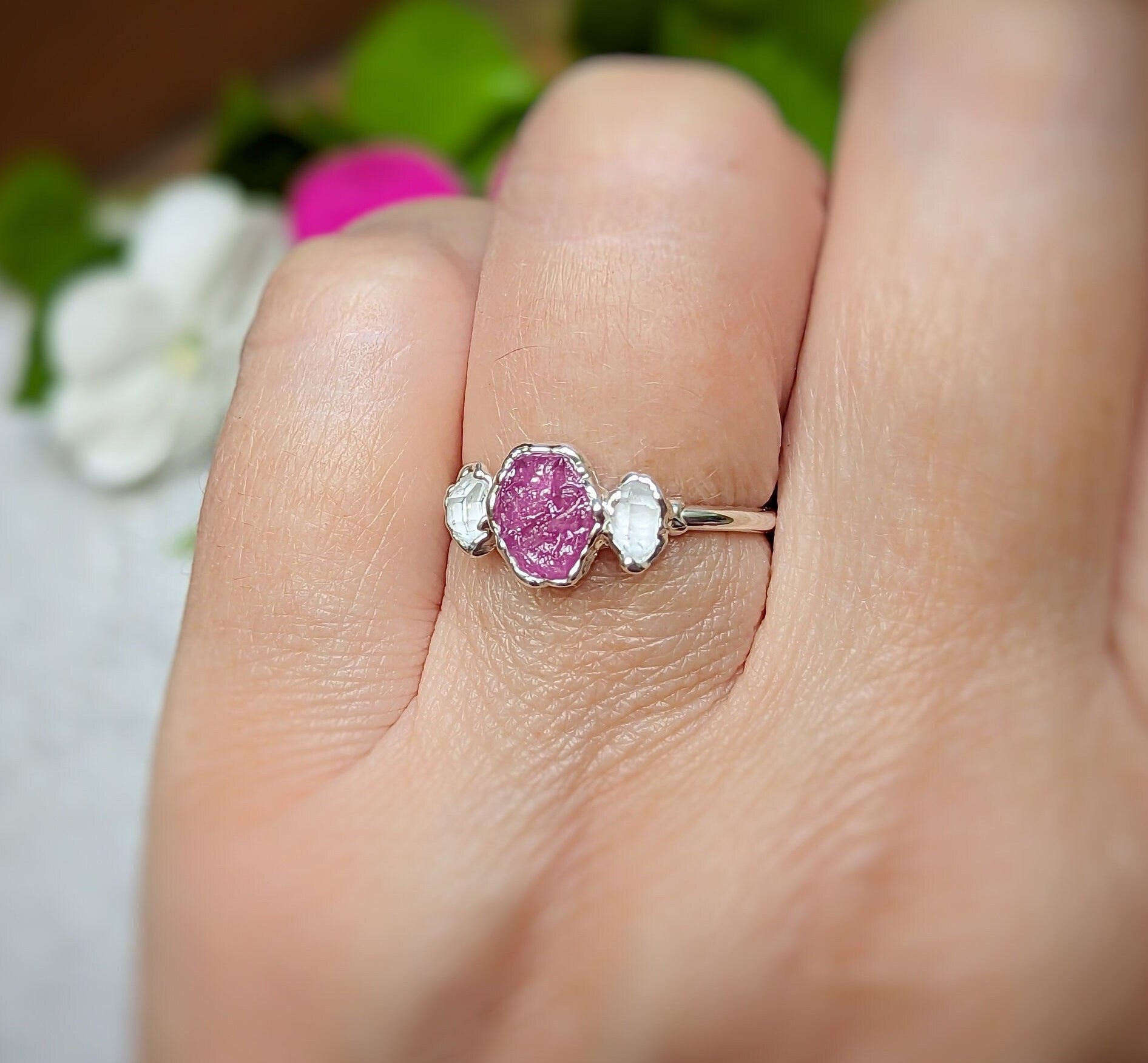 Dainty raw pink Sapphire and Herkimer diamond engagement ring on hand, handcrafted on Sterling Silver band.