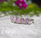 Raw pink Sapphire Eternity ring on a silver band, featuring 5-7 unique small sapphires, perfect for special occasions.