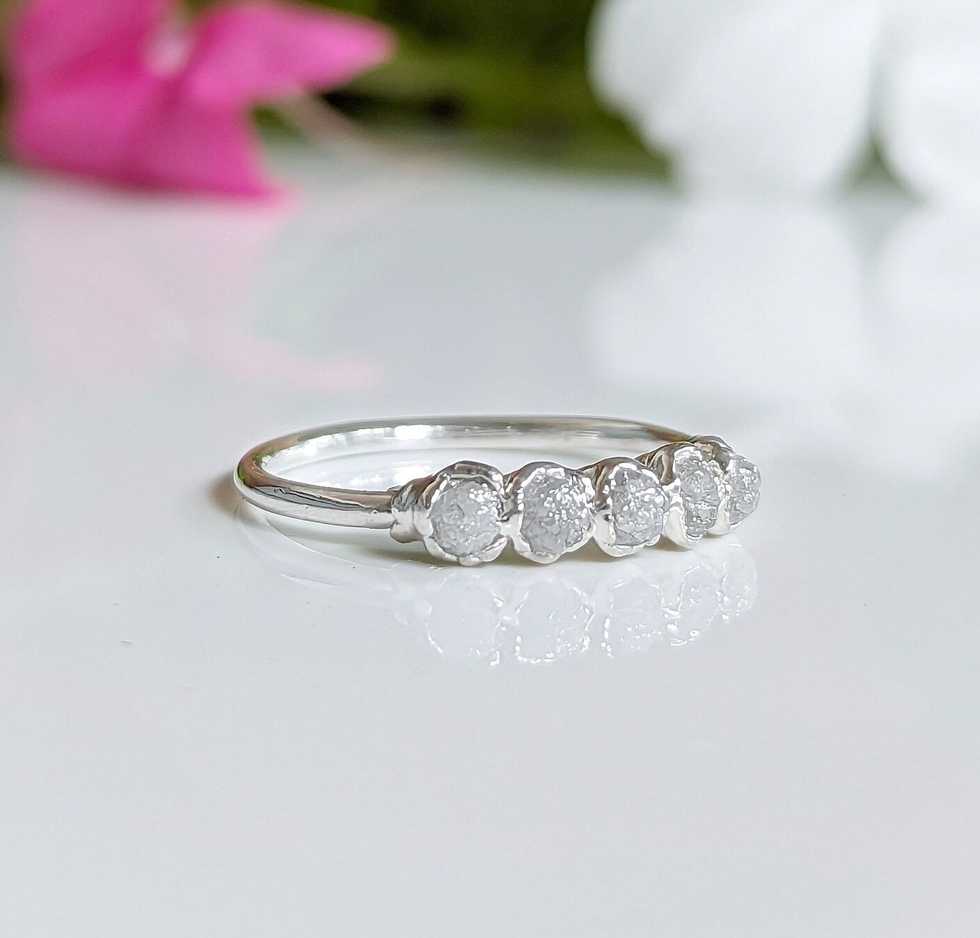 Raw diamond wedding band in silver with five small conflict-free diamonds, ideal for engagement or alternative wedding ring.