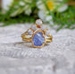 Rustic elegance: Raw Tanzanite ring with gold band and sparkling stones, perfect for special occasions.
