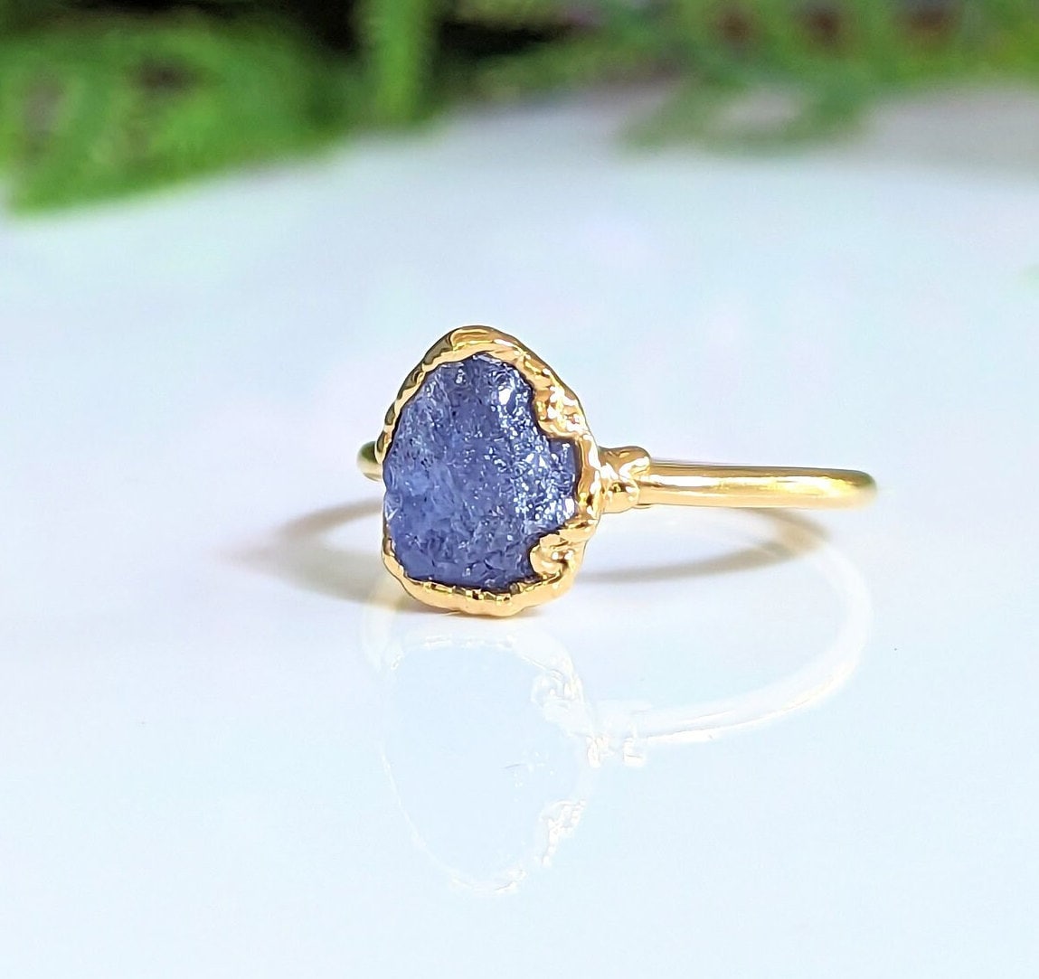 Raw Tanzanite ring set in an elegant 14k gold-filled band, showcasing a unique purple crystal for stylish jewelry.