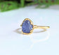 Raw Tanzanite ring set in an elegant 14k gold-filled band, showcasing a unique purple crystal for stylish jewelry.
