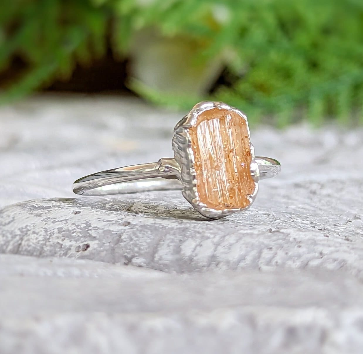 Raw golden Imperial Topaz ring on handcrafted sterling silver band, ideal gift for special occasions.