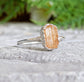 Raw golden Imperial Topaz ring on handcrafted sterling silver band, ideal gift for special occasions.