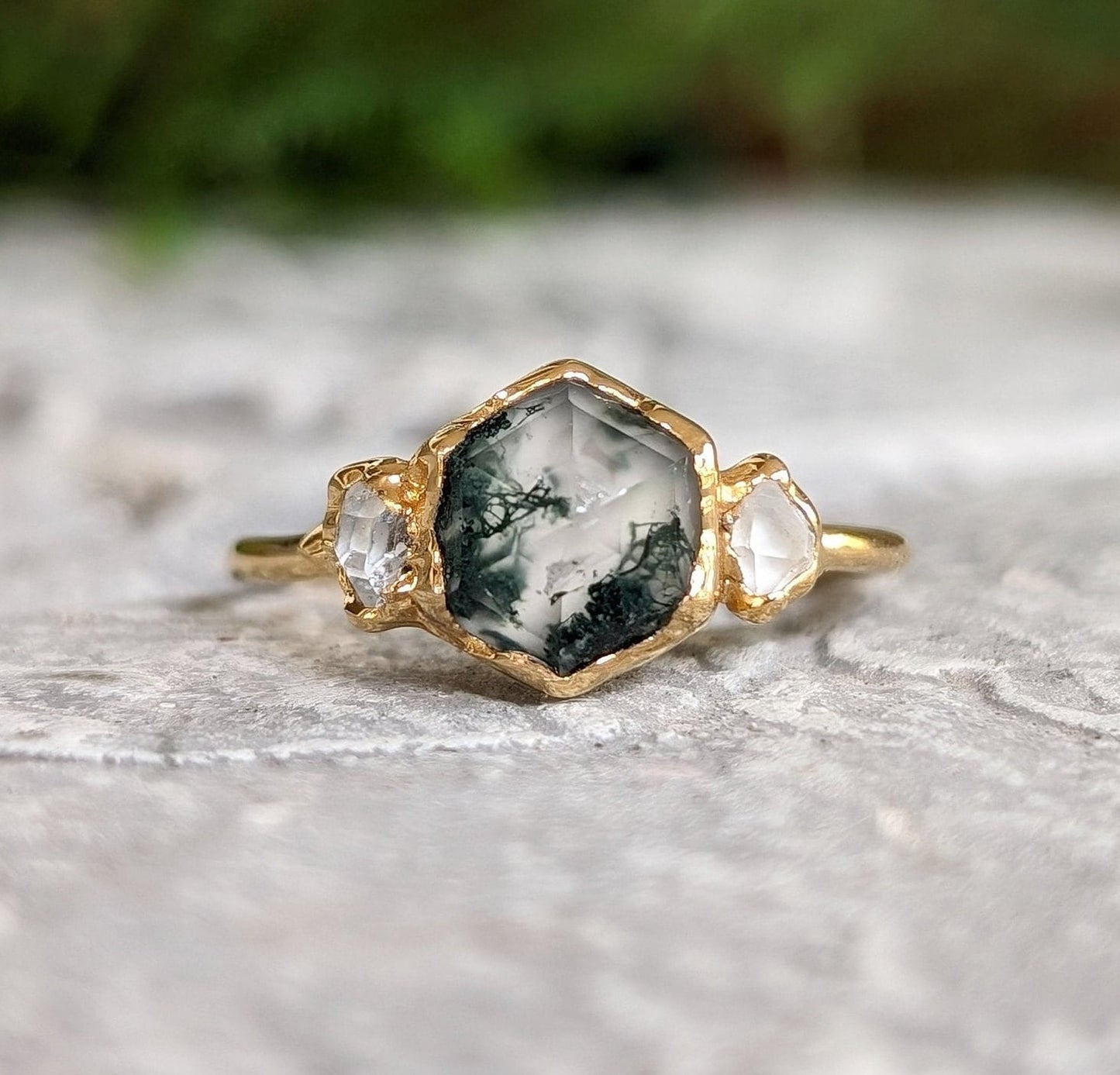 Moss Agate hexagon engagement ring with Herkimer diamonds on gold band, showcasing natural beauty and rustic elegance.
