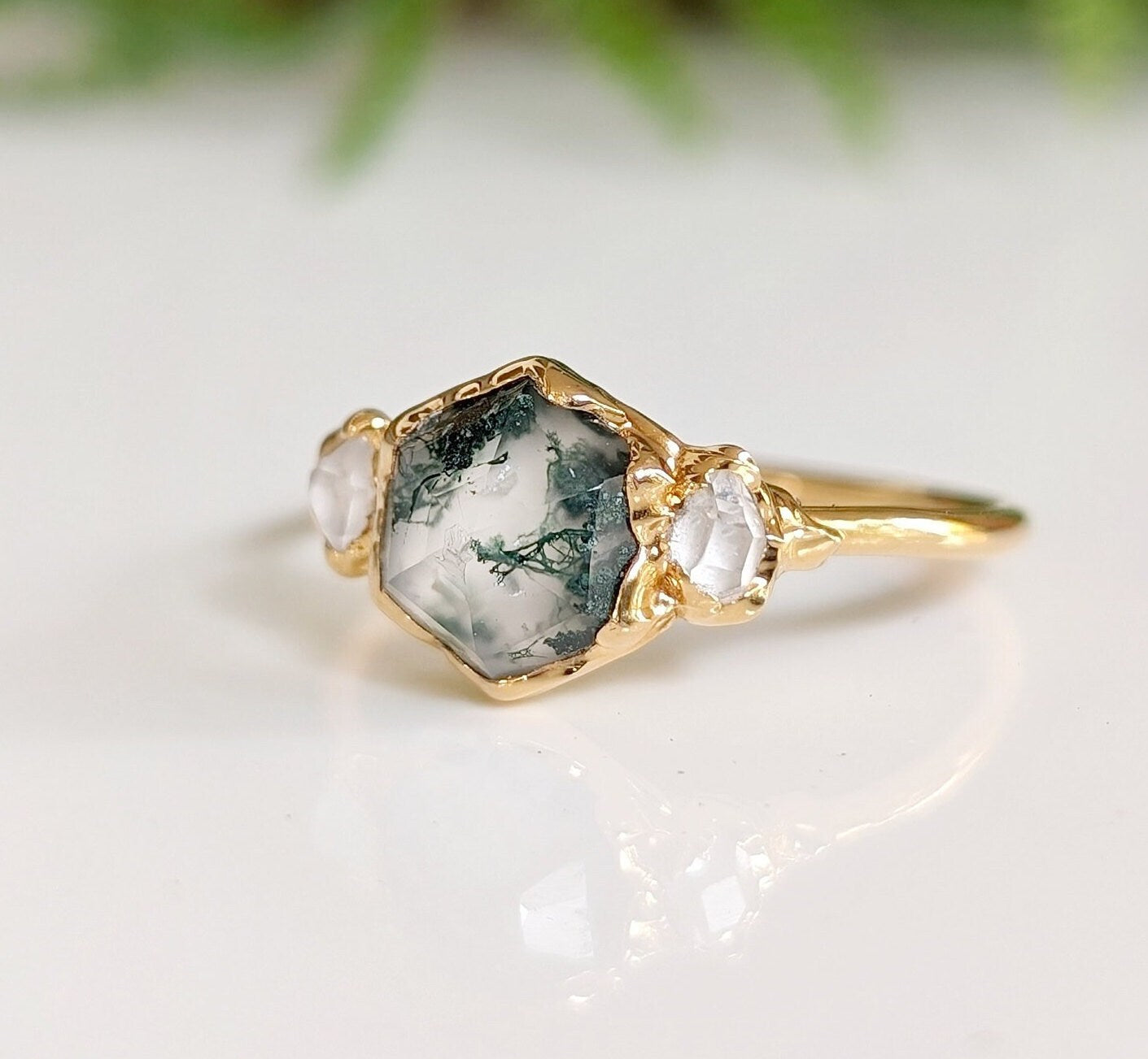 Hexagon Moss Agate engagement ring with Herkimer diamonds on a 14k gold band, showcasing nature-inspired beauty.