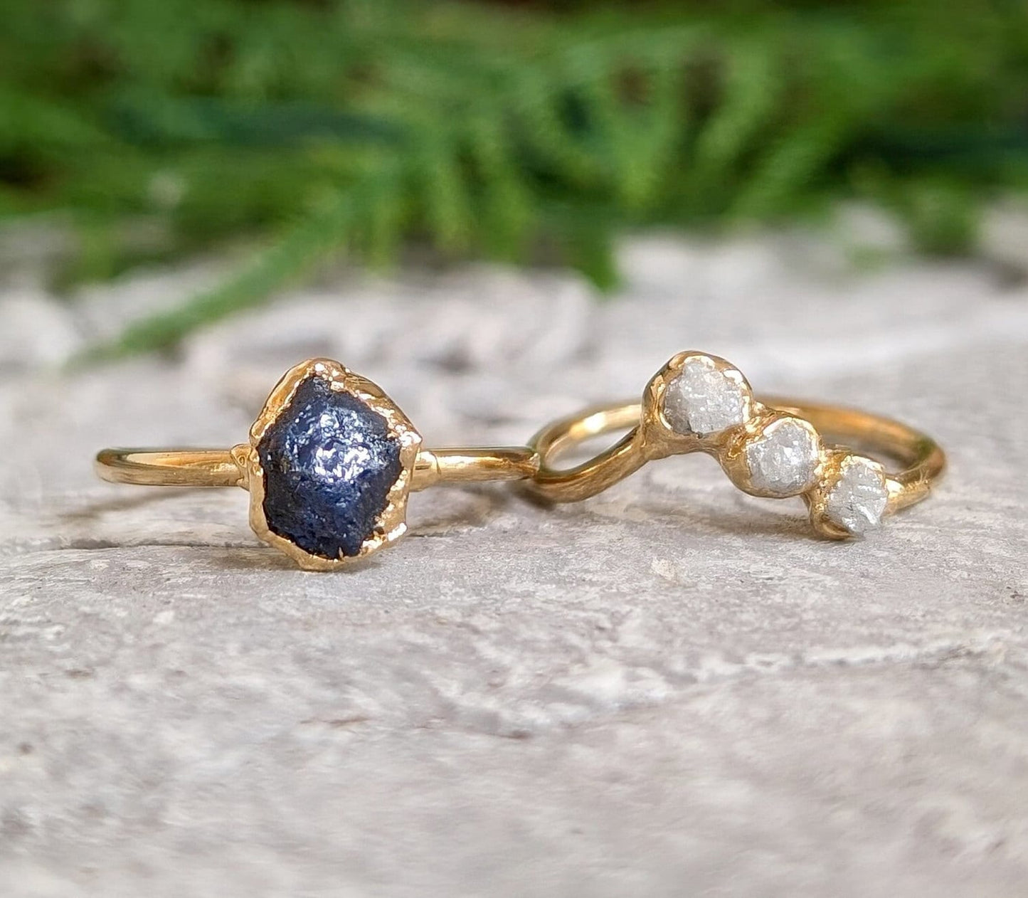 Unique raw sapphire and diamond wedding ring set on gold bands, perfect for nature lovers and timeless elegance.