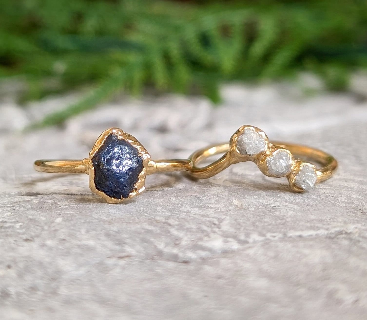 Unique raw sapphire and diamond wedding ring set on gold bands, perfect for nature lovers and timeless elegance.