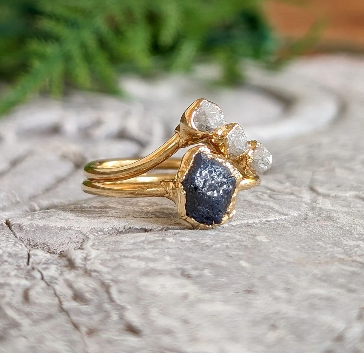Unique raw Sapphire and diamond wedding ring set in solid 14k gold, featuring a rustic chevron design.