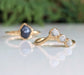 Raw sapphire and diamond wedding rings in gold settings, showcasing unique rustic designs perfect for nature lovers.