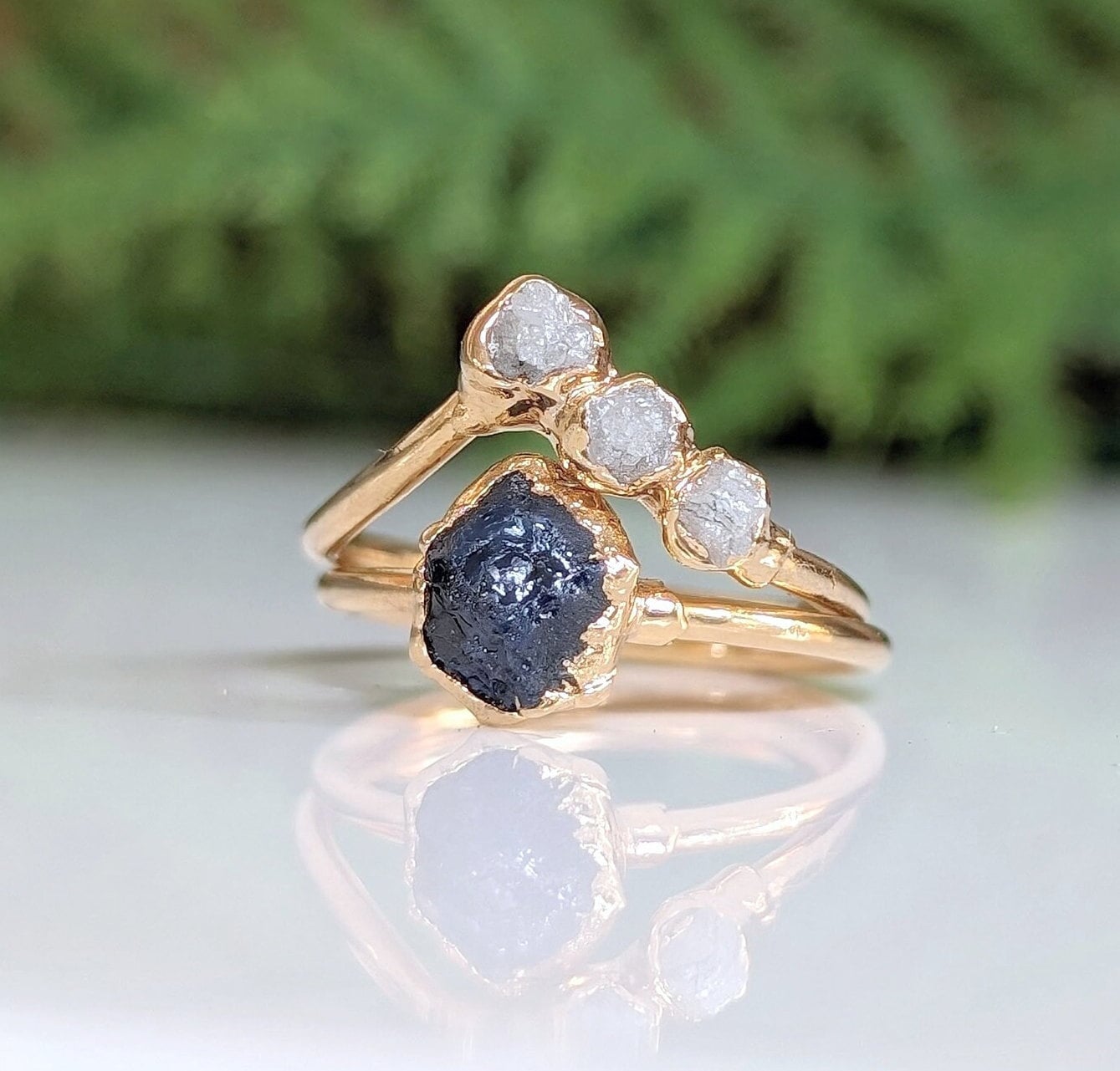 Raw sapphire and diamond wedding ring set on 14k gold, featuring unique handcrafted design and rustic elegance.