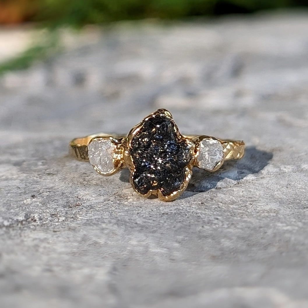 Raw uncut Black Diamond engagement ring on 14k Gold band with small raw diamonds, unique and handcrafted design.