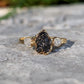 Raw uncut Black Diamond engagement ring on 14k Gold band with small raw diamonds, unique and handcrafted design.