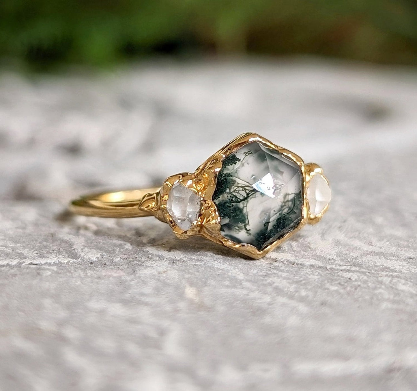 Moss Agate and Herkimer diamond engagement ring with hexagon shape set on a gold band.