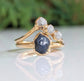 Unique raw sapphire and diamond wedding ring set on solid 14k gold bands, showcasing rustic elegance and nature-inspired design.