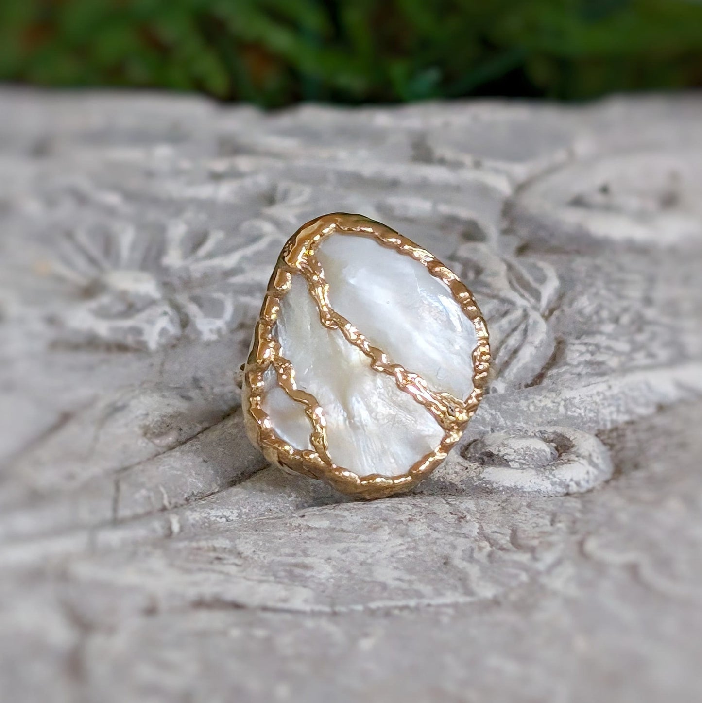 Handcrafted Mother of Pearl Kintsugi ring with gold-filled details, unique cocktail ring for special occasions.