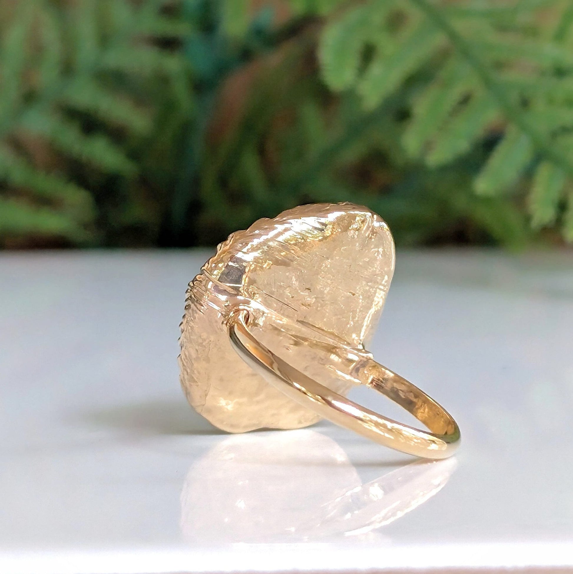 Handcrafted Mother of Pearl Kintsugi ring on a gold-filled band, showcasing unique artisanal design and elegance.