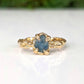 Raw Montana Sapphire engagement ring in solid 14k gold with organic textured band, showcasing natural elegance.