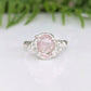 Pink Morganite engagement ring with sterling silver nature-inspired band, featuring an oval rose cut stone.