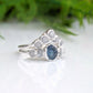 Raw Montana sapphire and diamond bridal ring set in sterling silver, featuring a teal sapphire and raw diamond accents.
