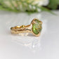 Stunning peridot ring in solid 14k gold with organic textured band, perfect as a unique engagement ring.