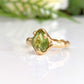 Handcrafted Peridot ring in solid 14k gold, featuring an organic textured band and a stunning green gemstone.