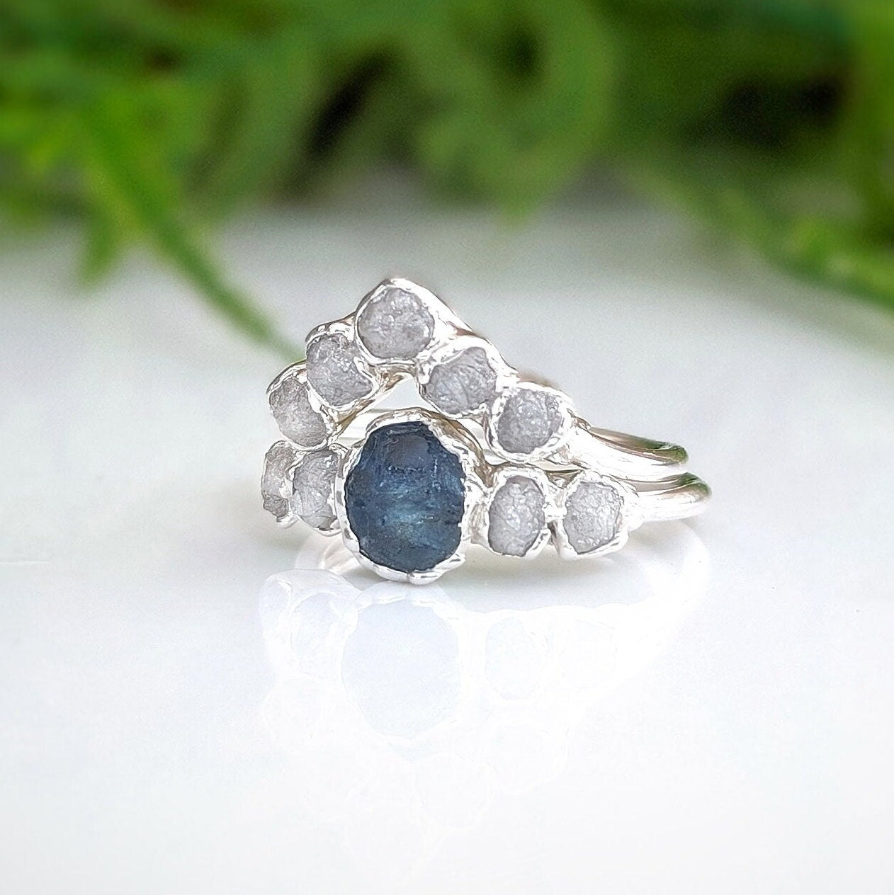 Raw Montana Sapphire and diamond bridal ring set in sterling silver, showcasing a unique teal blue stone and conflict-free diamonds.
